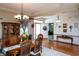 Welcoming dining room with wooden table and chairs, stylish decor, and abundant natural light at 1770 Valleywood Dr, Avon, IN 46123