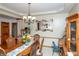 Formal dining room with elegant chandelier, traditional furniture, and warm lighting at 1770 Valleywood Dr, Avon, IN 46123