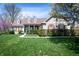 Charming home featuring a manicured lawn, covered porch, dormer windows, and red shutters at 1770 Valleywood Dr, Avon, IN 46123
