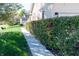 A well-maintained home exterior featuring a manicured hedge and sidewalk at 1770 Valleywood Dr, Avon, IN 46123