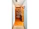 Charming hallway featuring hardwood floors, custom shelving, and decorative elements, creating a welcoming entrance at 1770 Valleywood Dr, Avon, IN 46123