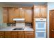 Kitchen features modern appliances, granite countertops, and lots of wood cabinets at 1770 Valleywood Dr, Avon, IN 46123