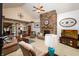 The living room is warm and inviting, featuring a stone fireplace, large windows, and neutral decor at 1770 Valleywood Dr, Avon, IN 46123