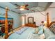 Spacious main bedroom with an ornate four-poster bed, dresser, and a ceiling fan at 1770 Valleywood Dr, Avon, IN 46123