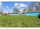 View of home with grass and outbuilding at 1857 Calvin St, Indianapolis, IN 46203