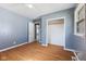 Cozy bedroom featuring wood flooring, modern paint, natural light, and closet storage at 1857 Calvin St, Indianapolis, IN 46203
