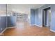 Spacious living room featuring wood flooring, modern paint, and a ceiling fan fixture at 1857 Calvin St, Indianapolis, IN 46203