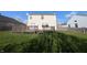 Backyard view of house with spacious deck and lawn, great for outdoor activities at 18904 Planer Dr, Noblesville, IN 46062