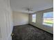 Bright bedroom featuring neutral walls, ceiling fan and two windows, carpet flooring at 18904 Planer Dr, Noblesville, IN 46062
