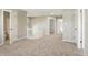 Upstairs hallway with carpeted floor, white railing, and multiple doorways at 18904 Planer Dr, Noblesville, IN 46062