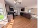 Bright kitchen featuring stainless steel appliances, wood cabinets, granite countertops, and hardwood floors at 18904 Planer Dr, Noblesville, IN 46062