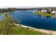 Aerial view of a large backyard extending to a calm lake, perfect for outdoor enjoyment at 1927 Westminster Pl, Columbus, IN 47201