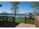Backyard view from deck featuring water view, wrought iron decor and bright green grass at 1927 Westminster Pl, Columbus, IN 47201