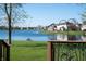 Serene backyard view showcasing a lush lawn that meets a peaceful lake at 1927 Westminster Pl, Columbus, IN 47201
