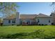 Spacious backyard view from home featuring green grass and privacy at 1927 Westminster Pl, Columbus, IN 47201
