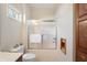 Bathroom featuring toilet, glass shower and cabinet for extra storage at 1927 Westminster Pl, Columbus, IN 47201