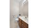 Bathroom featuring toilet, vanity and a large mirror at 1927 Westminster Pl, Columbus, IN 47201