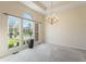 Bright dining room with large windows and a chandelier at 1927 Westminster Pl, Columbus, IN 47201