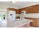 Spacious kitchen island featuring a large sink, abundant counter space, and wooden cabinetry at 1927 Westminster Pl, Columbus, IN 47201