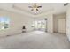 Large main bedroom with a sliding glass door offering outdoor access and a beautiful tray ceiling at 1927 Westminster Pl, Columbus, IN 47201
