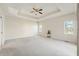 Spacious main bedroom featuring tray ceilings and large windows for plenty of natural light at 1927 Westminster Pl, Columbus, IN 47201
