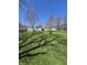 Expansive backyard offering plenty of space and opportunity for gardening or recreation at 2018 Poplar St, Anderson, IN 46012