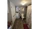 Cozy bathroom with grey walls, wooden floors, vanity and cabinet with mounted mirror at 2018 Poplar St, Anderson, IN 46012