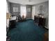 Bedroom with neutral walls, green carpet and lots of extra space at 2018 Poplar St, Anderson, IN 46012