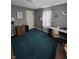Bedroom with neutral walls, green carpet, a work desk and good lighting at 2018 Poplar St, Anderson, IN 46012