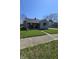 Charming home with a covered front porch, bench seating, and meticulously kept landscaping at 2018 Poplar St, Anderson, IN 46012