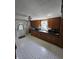 Eat-in kitchen features a double basin sink, ample cabinetry, and natural light at 2018 Poplar St, Anderson, IN 46012