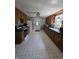 Eat-in kitchen features matching appliances, double basin sink, and ample cabinetry at 2018 Poplar St, Anderson, IN 46012