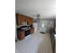 Eat-in kitchen features matching appliances, double basin sink, and ample cabinetry at 2018 Poplar St, Anderson, IN 46012