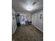 Neutral living room with black display cabinet and console table at 2018 Poplar St, Anderson, IN 46012