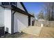 Backyard featuring new deck, white vinyl siding with black trim at 2216 Bethel Ave, Indianapolis, IN 46203