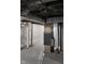Open basement featuring painted walls, support columns, and visible overhead pipes and wiring at 2216 Bethel Ave, Indianapolis, IN 46203