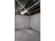 Cleaned and painted basement with concrete floor and exposed ceiling at 2216 Bethel Ave, Indianapolis, IN 46203