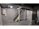 Basement staircase with open ceiling, painted walls, and exposed ductwork at 2216 Bethel Ave, Indianapolis, IN 46203