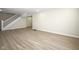 Open basement area features hardwood floors and white trim with a staircase at 2216 Bethel Ave, Indianapolis, IN 46203