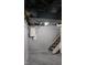 Unfinished basement with painted walls, exposed pipes, and visible electrical panel at 2216 Bethel Ave, Indianapolis, IN 46203