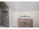 Bathroom featuring vanity with granite countertop, stylish tile work in shower and marble look floors at 2216 Bethel Ave, Indianapolis, IN 46203