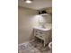 Updated bathroom featuring a white vanity with marble floors and black hardware at 2216 Bethel Ave, Indianapolis, IN 46203