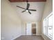 Bedroom featuring a ceiling fan with lights, and a doorway to an ensuite bathroom with wood-look flooring at 2216 Bethel Ave, Indianapolis, IN 46203