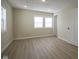 Sunlit bedroom with light colored walls, modern floors, and new trim at 2216 Bethel Ave, Indianapolis, IN 46203