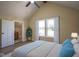 Bright bedroom featuring a vaulted ceiling, ensuite bath, and large windows for ample natural light at 2216 Bethel Ave, Indianapolis, IN 46203