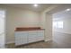 A butler pantry featuring butcher block counter, white cabinets, and an open floor plan at 2216 Bethel Ave, Indianapolis, IN 46203