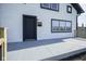 Charming home exterior featuring a black door, black trim, and a concrete porch at 2216 Bethel Ave, Indianapolis, IN 46203