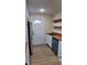 Bright kitchen with stainless steel refrigerator, wooden countertops, and open shelving at 2216 Bethel Ave, Indianapolis, IN 46203