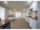 Open concept kitchen featuring white cabinetry, wood countertops, and modern flooring at 2216 Bethel Ave, Indianapolis, IN 46203