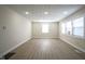 A bright, open living area with hardwood floors and plenty of natural light at 2216 Bethel Ave, Indianapolis, IN 46203